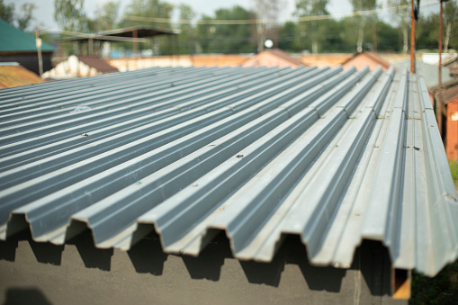Garage roof. The roof of the outbuilding. Stainless steel. Galvanized surface.