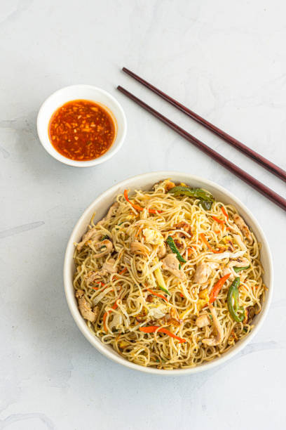istock Wok Tossed Chicken Noodles Vertical Top Down Photo 1383009280