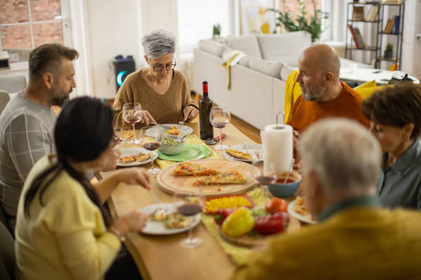 istock Caucasian friends enjoy the lunch together 1383009768
