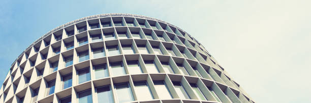 istock business building on blue sky background 1383010141