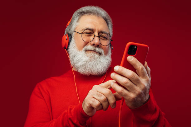 istock Portrait of emotional old man using smart phone 1383012027