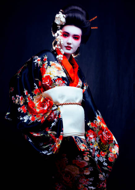 young pretty geisha in kimono with sakura and decoration stock photo