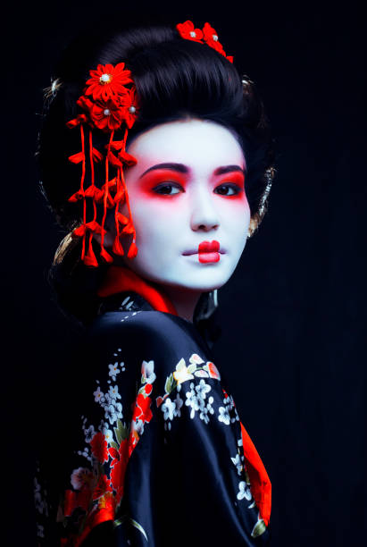 young pretty geisha in kimono with sakura and decoration stock photo