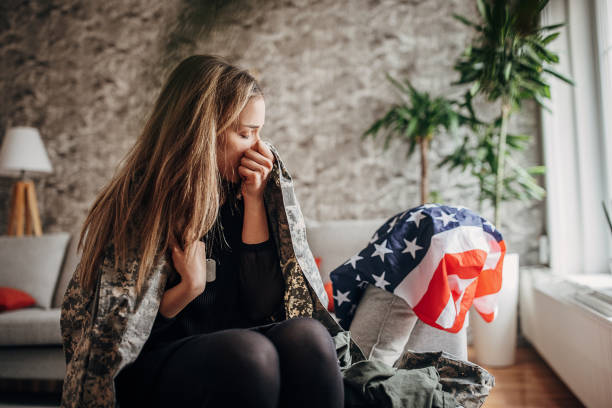 istock Widow crying at home because her husband has died in the war 1383014711