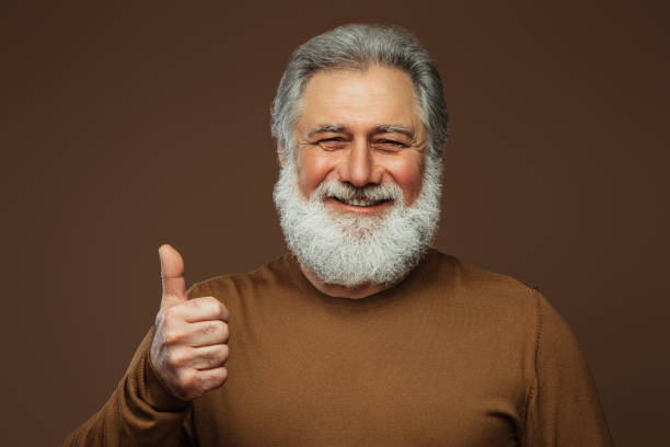 istock Portrait of a real happy old man 1383014967
