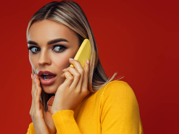 Beautiful emotional woman using smart phone