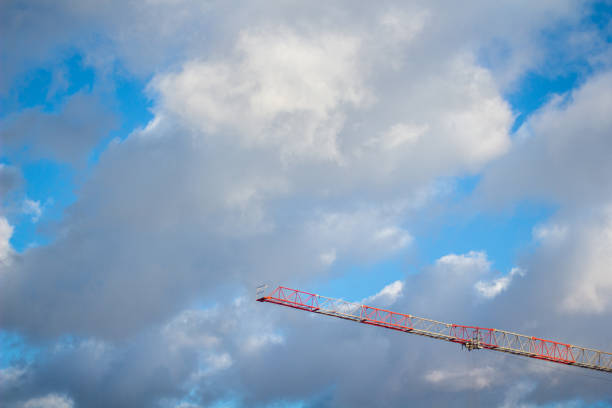 istock red crane on a background of blue sky with clouds 1383017149