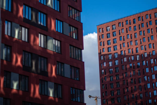 istock two red buildings on the blue sky 1383017158