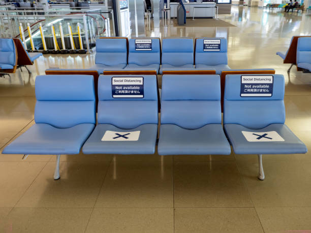 istock Social distancing sign on bench. 1383017213