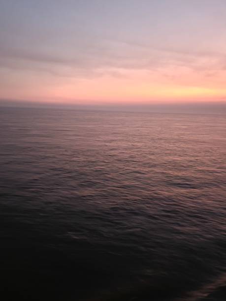 istock Sunset mid at the sea 1383018353