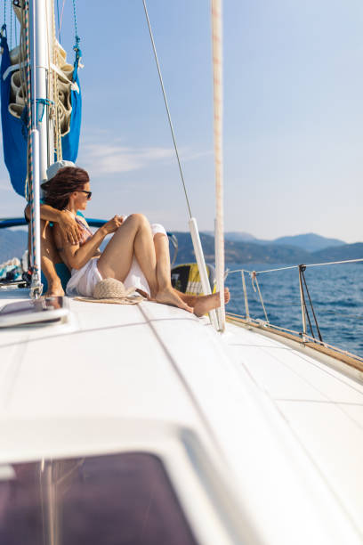 istock Mature couple enjoying sunny day on yacht 1383018672