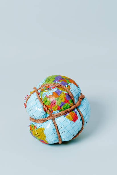 istock earth globe tied with rope 1383019843