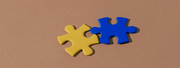 istock puzzle pieces as ukrainian flag, web banner 1383019886