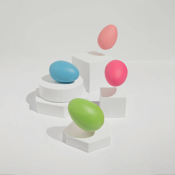 istock Bright and fun Easter concept with four colourful eggs jumping from white blocks. Trendy, minimal spring aesthetic. 1383020825