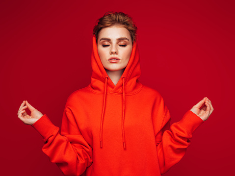 Close-up photo of trendy cheerful woman wearing hoodie