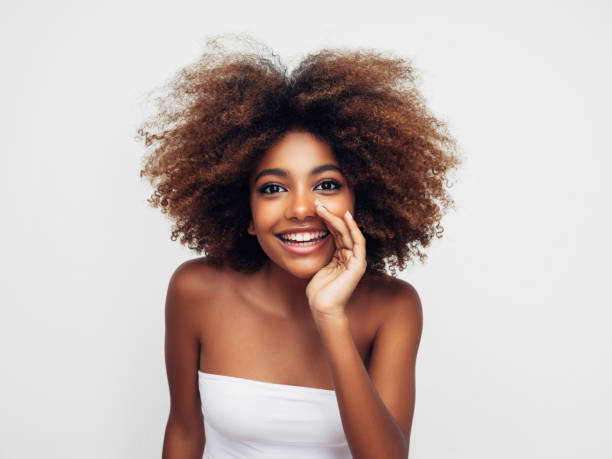 istock Beautiful smiling girl with curly hairstyle 1383022721