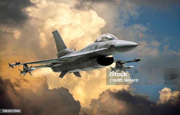 F16 Fighting Falcon Fighter Jet Against Dramatic Clouds Stock Photo - Download Image Now