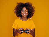 Woman holding joystick and playing