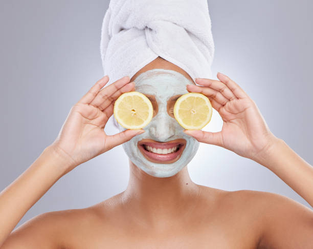istock Shot of an unrecognisable woman feeling playful while while holding lemons over her eyes 1383025185
