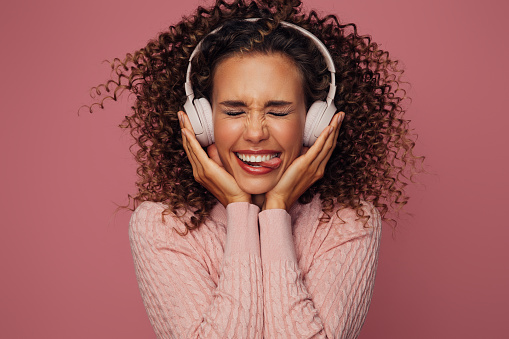 Beautiful emotional woman listening to music