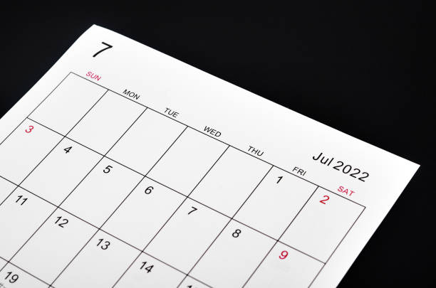 istock July 2022 calendar sheet on black background. 1383028520