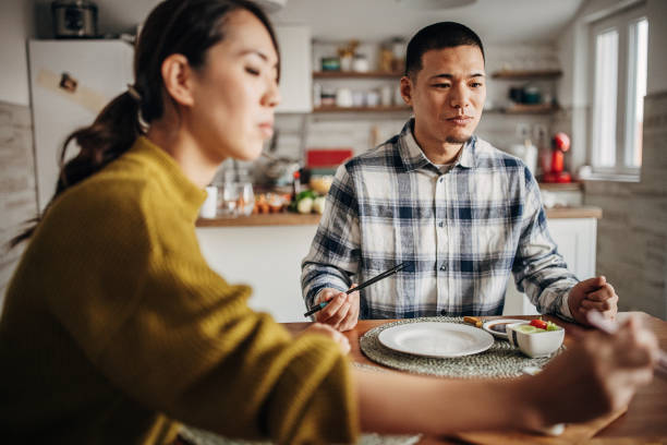 istock Couple eating sushi at home 1383028690