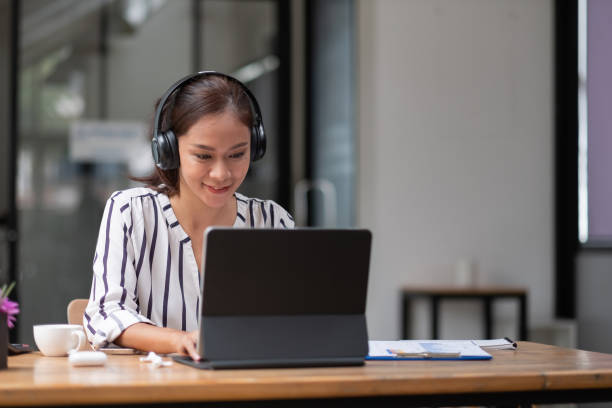 istock Portrait young woman student study at home using laptop and learning online 1383035206