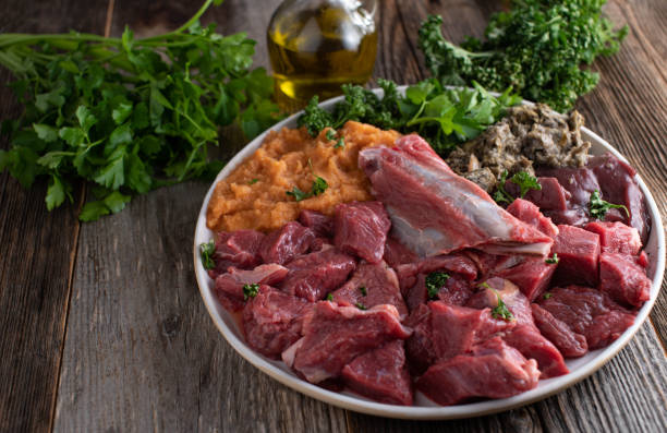 Raw meat feeding for dogs or pets stock photo