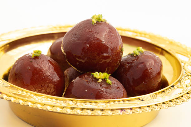 istock Kala Jamun Also Called Dark Gulab Jamun Is Milk Solids Based Mithai Made of Mashed Khoya Grated Paneer Elaichi Khoa Panir In Cheeni Ki Chasni. Food Theme For Holi, Deepawali, Rakshabandhan, Dussehra 1383036879
