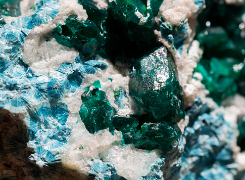 macro photography of natural mineral from geological collection - raw green aventurine stone on white background