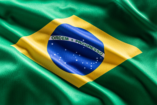 Ondeando la bandera de Brasil. Símbolo nacional del país y del estado. photo