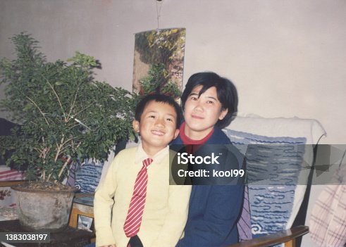 istock 1980s Chinese Little Boy and Mother Old Photo of Real Life 1383038197