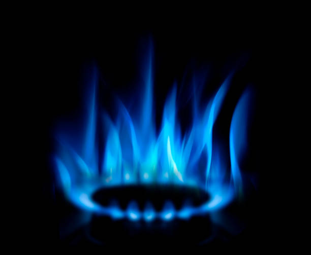 flammes de gaz bleu sur fond sombre - flame gas natural gas blue photos et images de collection