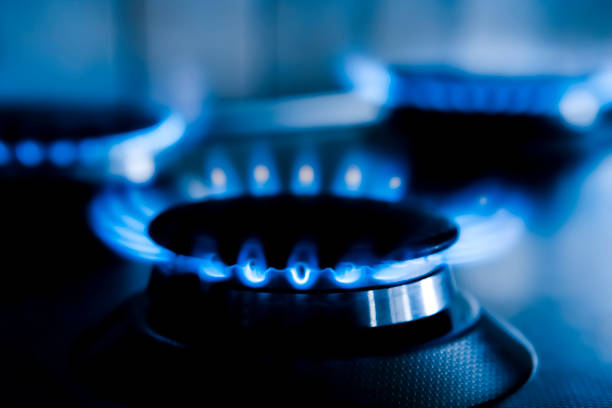 istock Blue gas flames against a dark background 1383039252