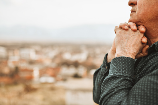 Praying Hands Wrapped Together Of Senior Adult Thinking With Hope About Better Future