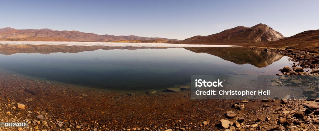 Arctic Circle Trail lake and mountain landscapes between Kangerlussuaq and Siimiut in Greenland. Adventure Stock Photo
