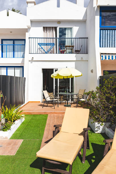 istock Small cozy bungalow with a small back yard 1383043923
