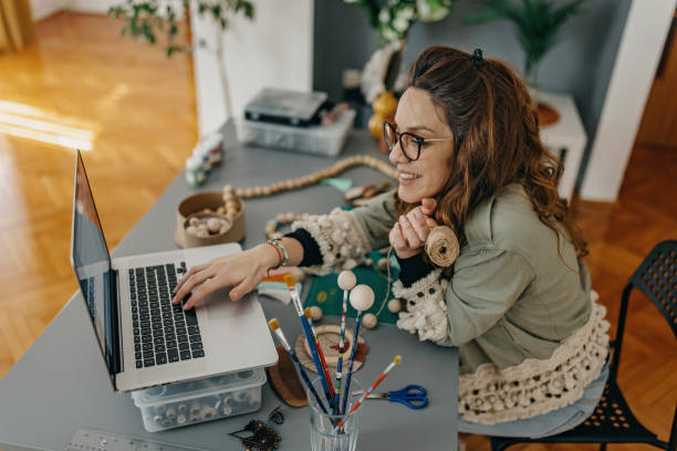 istock Young women small business owner using technology at the studio 1383045344