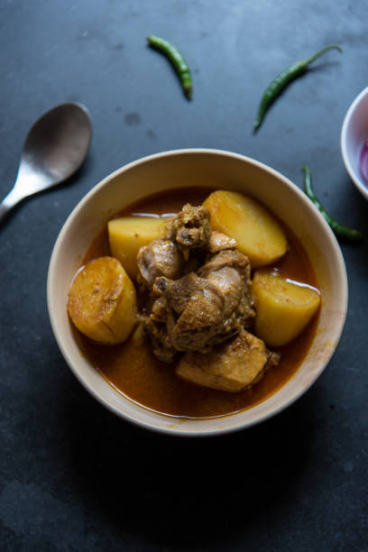 istock Indian style chicken curry served in a bowl on a dark background. 1383047802