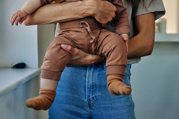 istock Mother taking care about her little son 1383047869