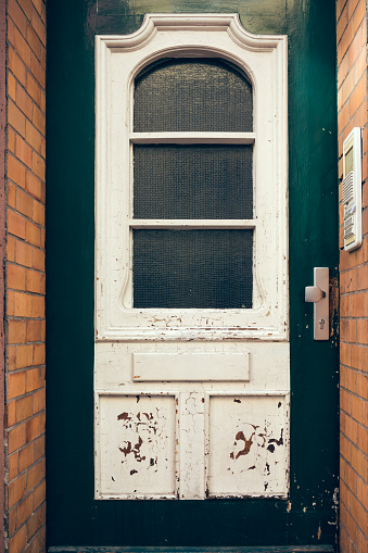 an old nostalgic wooden front door in the city