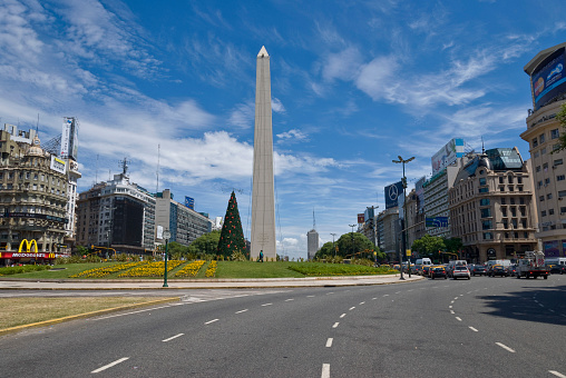 Buenos Aires, Argentina. January 3, 2011: 9th of july avenue, one of the widest in the world and the Obelisk in Republic Square.