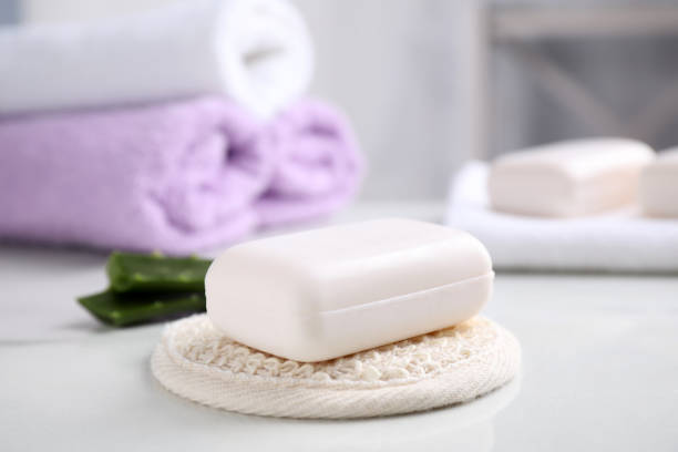 istock Soap bar and cloth on white table indoors 1383050600