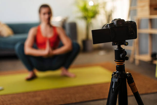 istock Camera filming yoga 1383051129