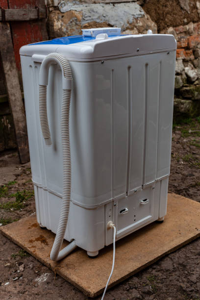 istock semiautomatic washing machine standing in the courtyard 1383054001