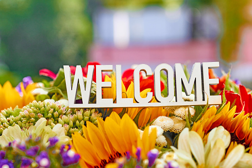 Welcome sign on flower bouquet