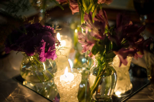 istock Flower vases and a candle illuminating 1383056124