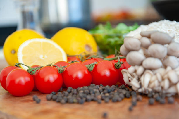 cherry tomato, lemon, rice, leek, chopped onion, misanplace ready to start vegetarian food preparation