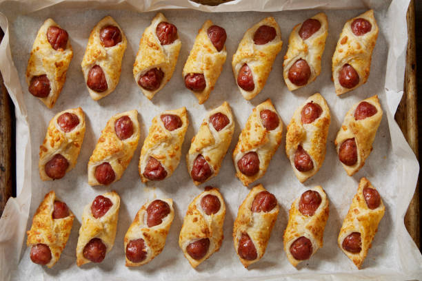 Cocktail Wieners Wrapped in Puff Pastry and Coated in Parmesan Cheese