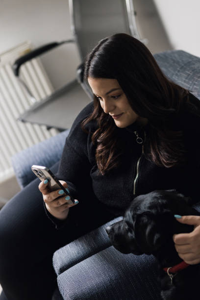 istock Plus size woman with her dog in pet friendly office 1383068976